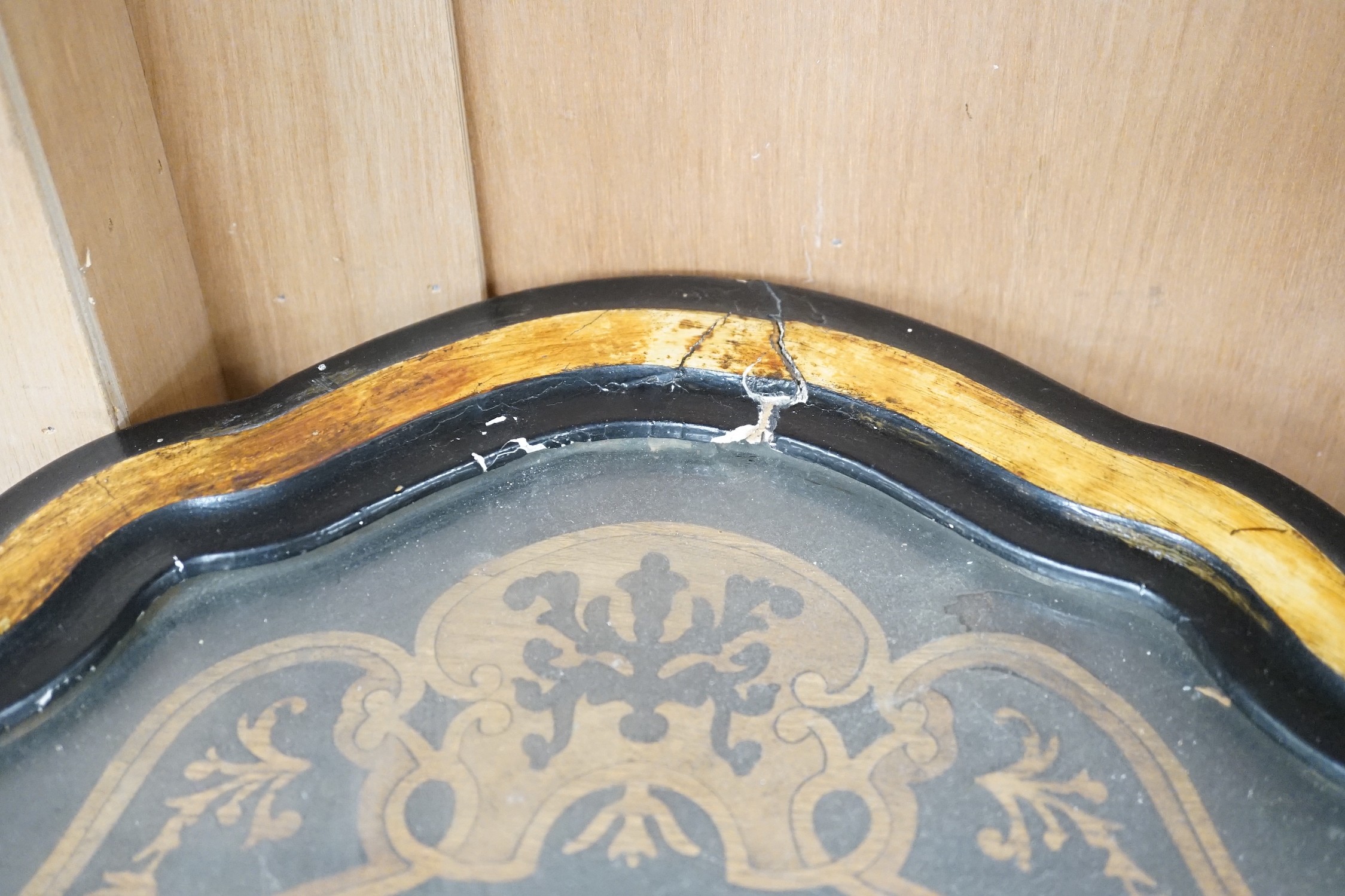 A late 19th century oval French marquetry wall clock with enamel Roman numerals, 62cms high